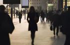 Silhouette of people and commuters in city 