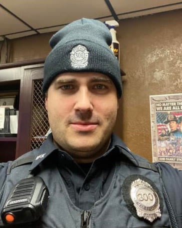 Officer Sean Sluganski, Chief Justin McIntire among dozen of line of ...