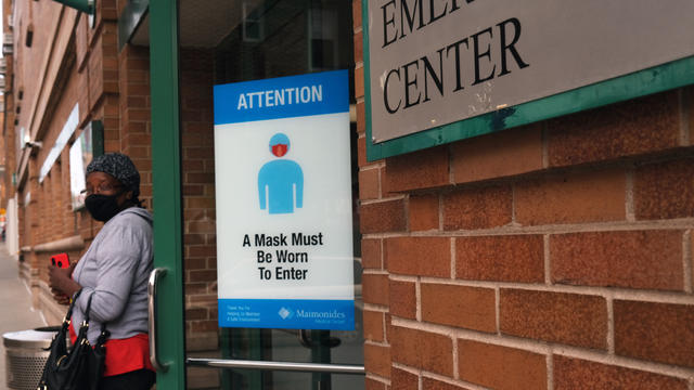 A sign in front a hospital instructs people to wear face masks on September 14, 2020 in the Brooklyn borough of New York City. 