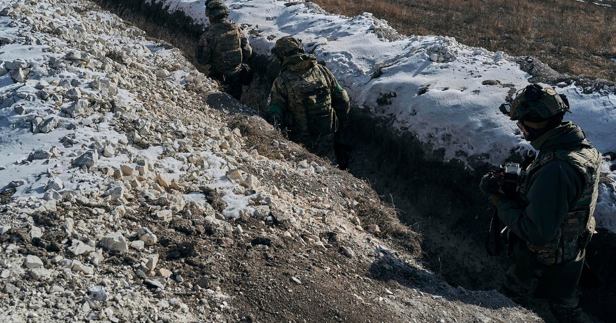 On the front line in Ukraine, where soldiers are "literally tossing grenades at each other"