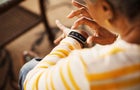 Close-up of senior woman using smart watch 