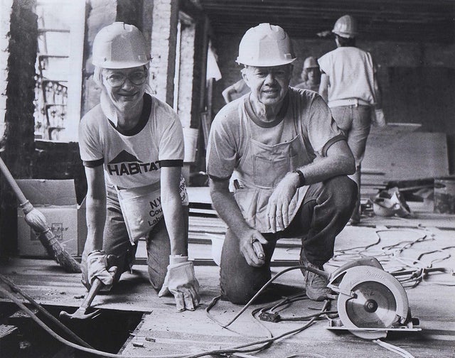 Rosalynn and Jimmy Carter at work renovating a tenement on the East 6th Street in the East Village in Manhattan on September 4, 1984. 