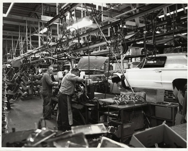 Men Working on Auto Assembly Line 