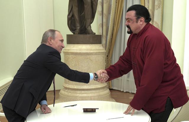 Putin gives Russian state award to actor Steven Seagal for 