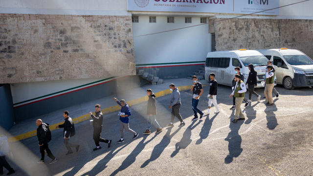 Immigrants, most from Venezuela, are escorted by Mexican immigration agents after being expelled from the U.S. on Jan. 9, 2023, in Ciudad Juárez, Mexico. 