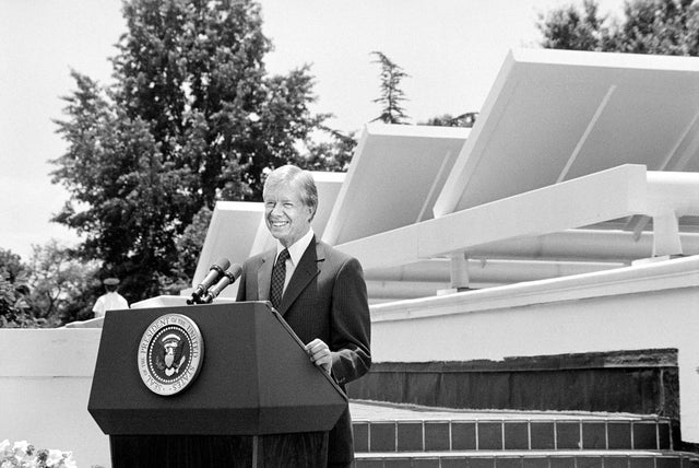 U.S. President Jimmy Carter speaking in front of Solar Panels placed on West Wing roof of White House
