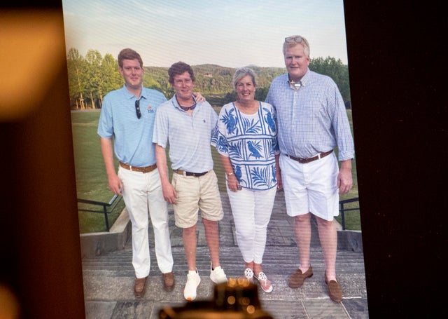 A family photo of Buster, Paul, Maggie and Alex is shown during the murder trial of Alex Murdaugh at the Colleton County Courthouse in Walterboro, S.C., on Thursday, March 2, 2023.