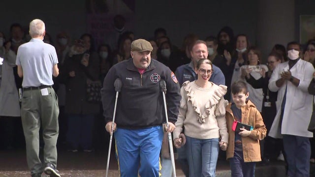 Michael Guidera leaves the hospital on crutches. 