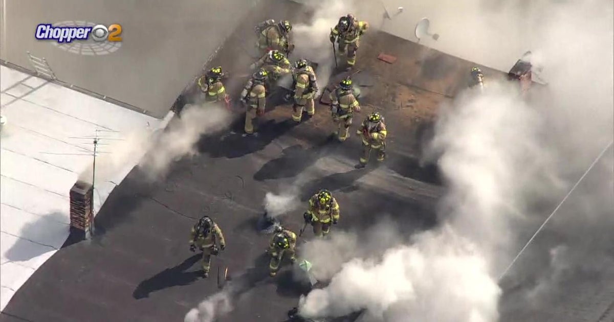 2 hospitalized after fire tears through building in Jersey City - CBS ...
