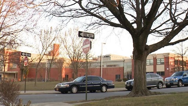 Police vehicles with overhead strobe lights at a crime scene 
