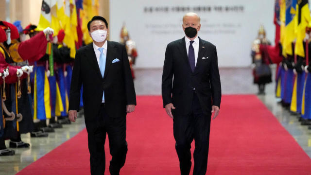 President Biden and South Korean President Yoon Suk Yeol arrive at the National Museum of Korea for a state dinner on May 21, 2022, in Seoul, South Korea. 