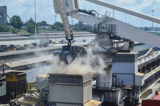 Grain is offloaded from a ship docked in the port of Mombasa, Kenya, Nov. 26, 2022, which arrived with 53,300 tons of wheat procured under the Black Sea Grain Initiative, a deal to ease the export of Ukrainian grain and foodstuffs