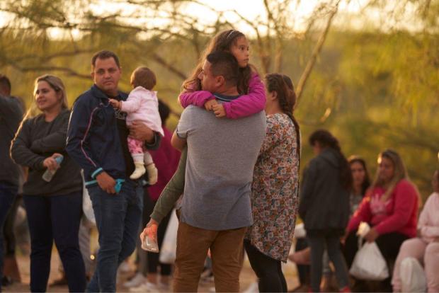 A father holds his daughter after they illegally crossed the U.S. southern border with Mexico on Oct. 10, 2022, in Eagle Pass, Texas. 