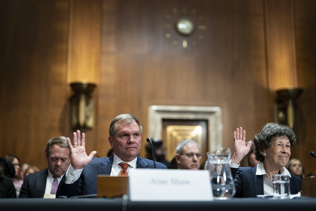 Alan Shaw, CEO of Norfolk Southern, is seen with Debra Shore, the regional administrator of the EPA 