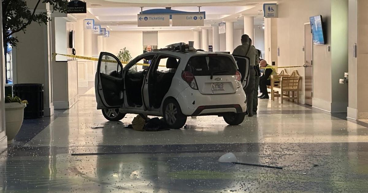 Automobile crashes inside terminal of North Carolina airport thumbnail