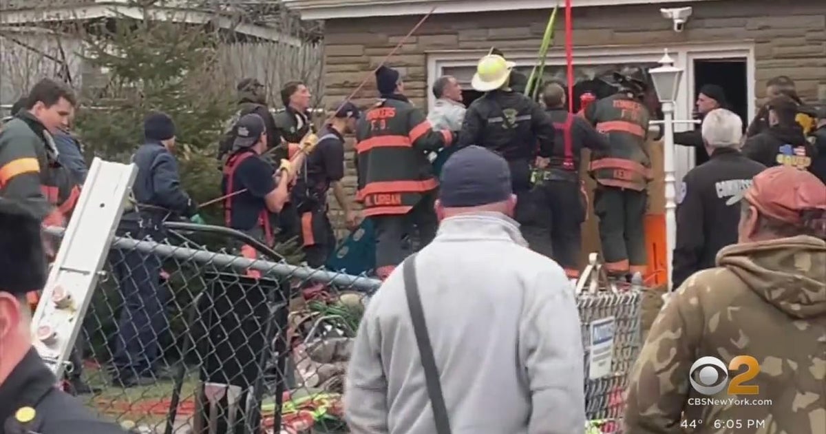 First responders rescue man trapped in trench in Yonkers - CBS New York
