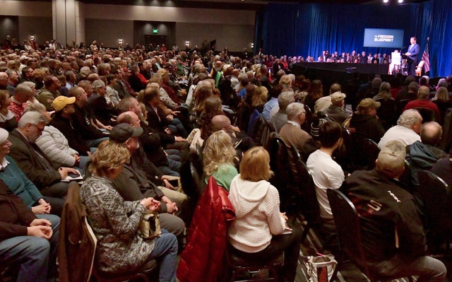 People listen as Florida Gov. Ron DeSantis speaks at an event on Friday, March 10, 2023, in Davenport, Iowa. 