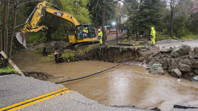 A road washed away in Santa Cruz as an atmospheric river hit California on March 10, 2023. 