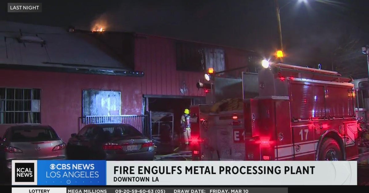 Firefighters tackle massive fire at metal processing plant in Downtown ...