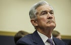 Headshot of Jerome Powell in a suit looking tired 