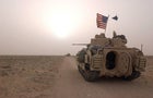 U.S. Army 3rd Division 3-7 Bradley fighting vehicles take up a position along a road on March 19, 2003, inside the demilitarized zone between Kuwait and Iraq. 
