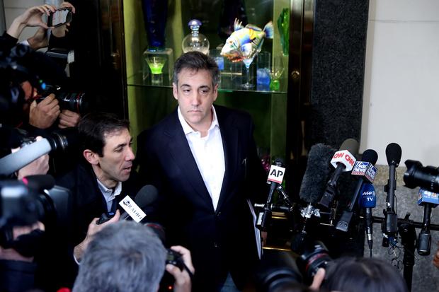 Michael Cohen addresses the press as he leaves his apartment to begin serving a 3-year sentence at a federal prison in New York on May 6, 2019. 