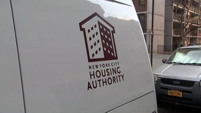 A vehicle with the New York City Housing Authority logo on it. 
