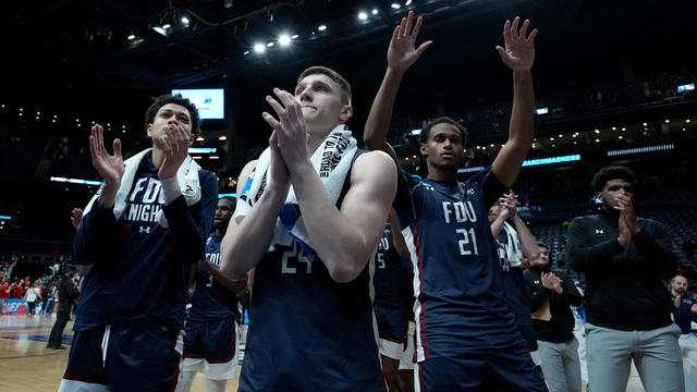 Brayden Reynolds #24 and Cameron Tweedy #21 of the Fairleigh Dickinson Knights wave to the crowd after being defeated by the Florida Atlantic Owls in the second round game of the NCAA Men's Basketball Tournament at Nationwide Arena on March 19, 2023 in Co 