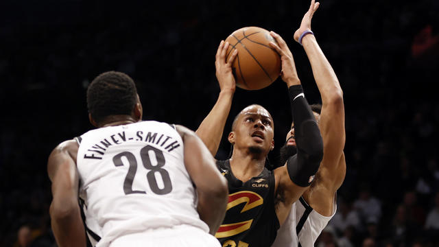 Isaac Okoro #35 of the Cleveland Cavaliers shoots the ball as Dorian Finney-Smith #28 and Spencer Dinwiddie #26 of the Brooklyn Nets defend during the second half at Barclays Center on March 23, 2023 in the Brooklyn borough of New York City. 