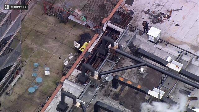 An aerial view of fire damage to the roof of a Brooklyn bakery. 