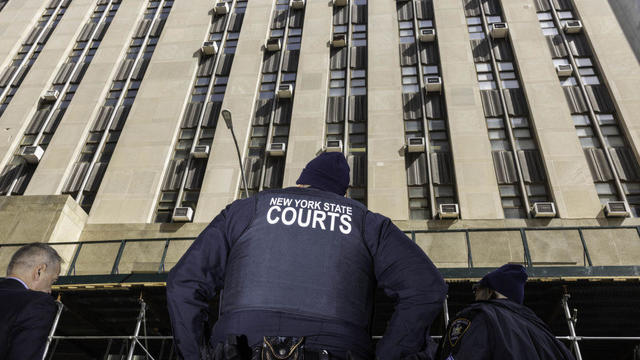 NYPD officers are seen outside the courthouse in lower Manhattan on Friday, March 31, 2023, one day after the district attorney said a grand jury voted to indict former President Donald Trump. 