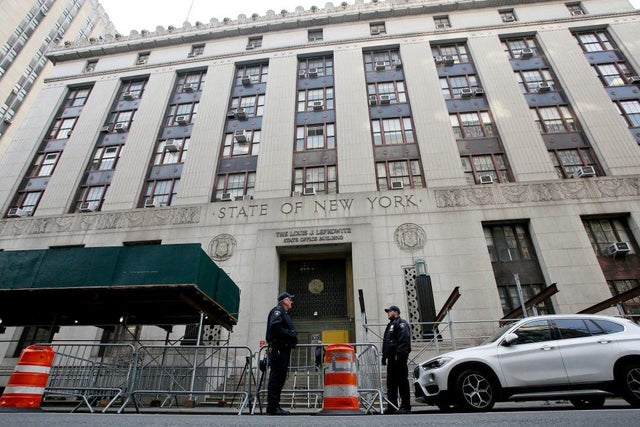 NYPD officers provide security outside the Manhattan district attorney's office in New York City on March 31, 2023. 