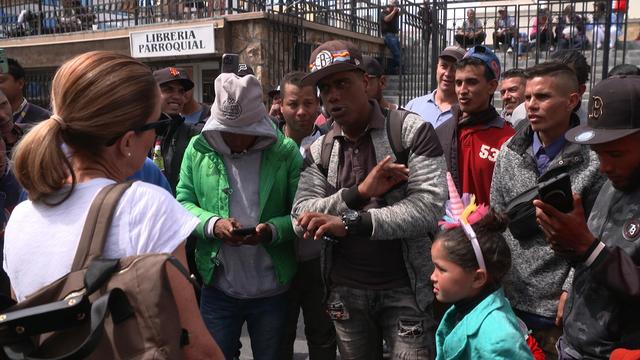 mayorkas-8-sharyn-talking-to-men-in-juarez-cathedral-plaza.jpg 