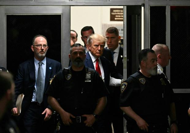 Former President Donald Trump makes his way inside the Manhattan Criminal Courthouse in New York on April 4, 2023. 
