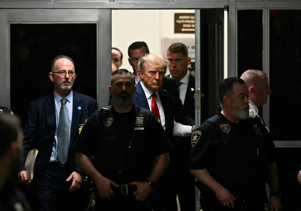 Former President Donald Trump makes his way inside the Manhattan Criminal Courthouse in New York on April 4, 2023. 