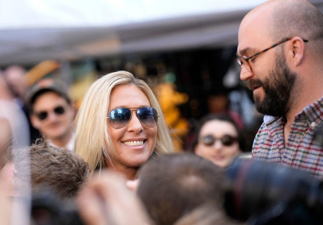 Rep. Marjorie Taylor Greene walks through the crowd gathered outside the courthouse where former President Donald Trump will arrive for his arraignment on April 4, 2023, in New York City.