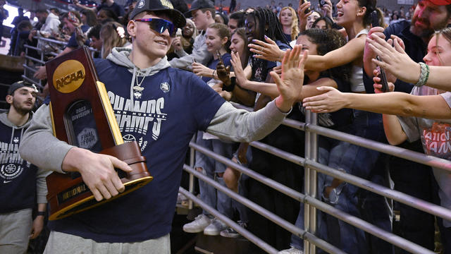 UConn's Donovan Clingan is greeted by fans as the team arrives for a rally at Gampel Pavilion in honor of UConn's NCAA men's Division I basketball championship, Tuesday, April 4, 2023, in Storrs, Conn. 