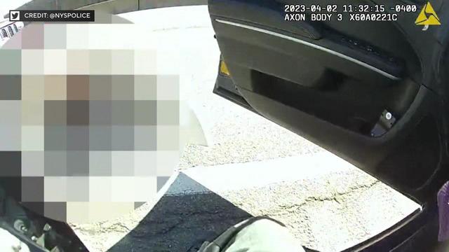 A still from body camera footage shows a state trooper opening their vehicle door. 
