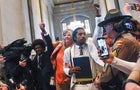 Tennessee Reps. Pearson, Johnson and Jones walk through crowd of supporters at Tennessee State Capitol in Nashville 