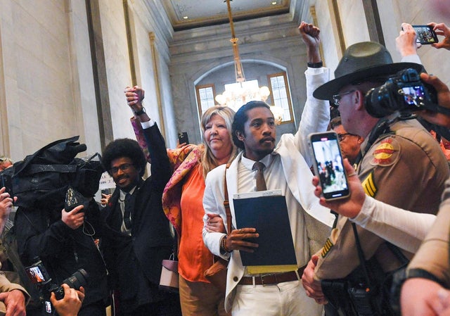 Tennessee Reps. Pearson, Johnson and Jones walk through crowd of supporters at Tennessee State Capitol in Nashville 