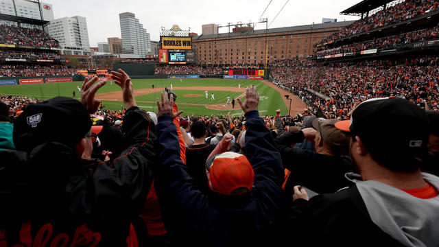 Fans celebrate after Baltimore Orioles defeated the New York Yankees 7-6 during the Orioles home opener at Oriole Park at Camden Yards on April 07, 2023 in Baltimore, Maryland. 