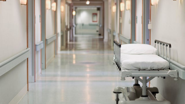 Portable hospital bed in hallway