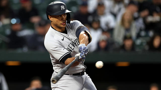 Giancarlo Stanton #27 of the New York Yankees hits a second inning single against the Baltimore Orioles at Oriole Park at Camden Yards on April 08, 2023 in Baltimore, Maryland. 