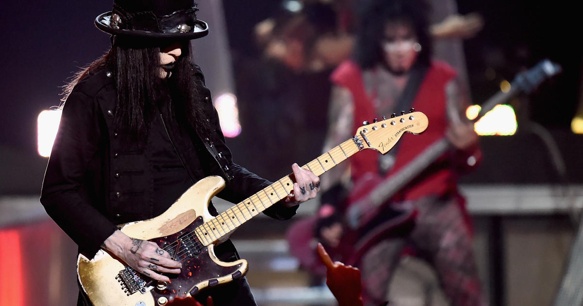 Mötley Crüe guitarist Mick Mars sues band, claiming he was fired for "horrific" disease