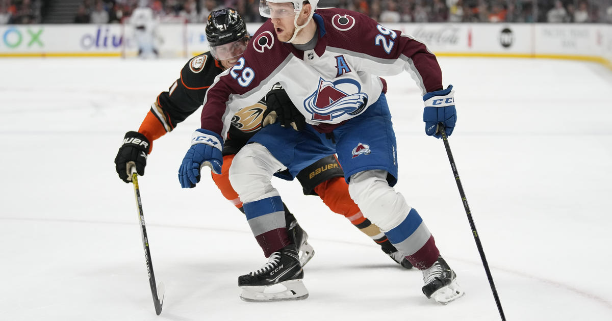 Nathan MacKinnon has goal and two assists as Colorado Avalanche withstand  Anaheim Ducks rally