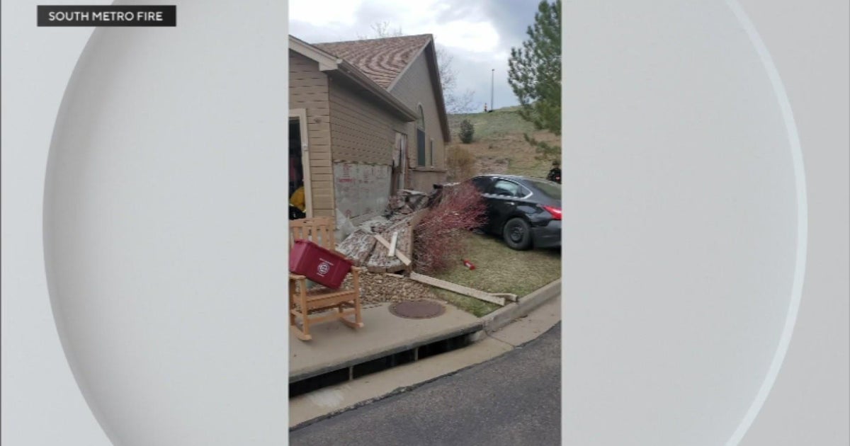 Driver hospitalized after crashing into garage in Lakewood - CBS Colorado