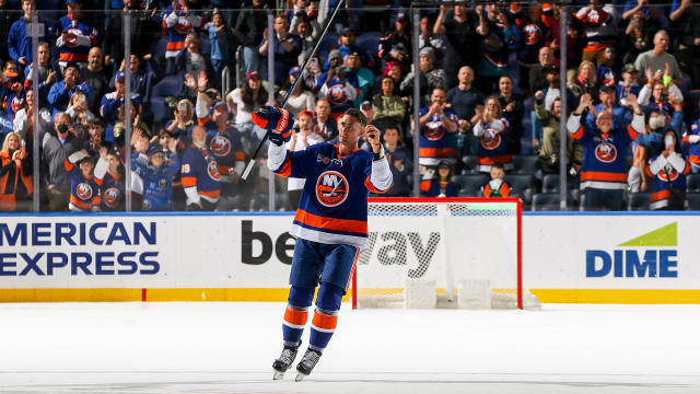 Brock Nelson #29 of the New York Islanders salutes the crowd after being named the first star in the 4-2 victory against the Montreal Canadiens to secure a place in the Stanley Cup Playoffs at UBS Arena on April 12, 2023 in Elmont, New York. 