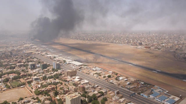 Smoke rises over the city as army and paramilitaries clash in power struggle, in Khartoum 