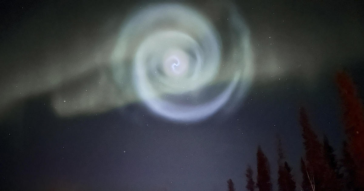 "Mysterious spiral" that looks like hazy, glowing galaxy seen hovering in Alaska's northern lights