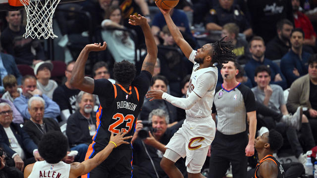 Darius Garland #10 of the Cleveland Cavaliers shoots over Mitchell Robinson #23 of the New York Knicks during the second quarter of Game Two of the Eastern Conference First Round Playoffs at Rocket Mortgage Fieldhouse on April 18, 2023 in Cleveland, Ohio. 